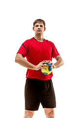 Image showing The one caucasian young man as handball player at studio on white background