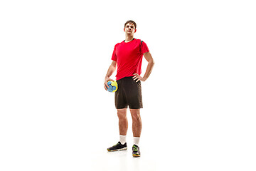 Image showing The one caucasian young man as handball player at studio on white background