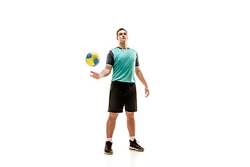 Image showing The one caucasian young man as handball player at studio on white background