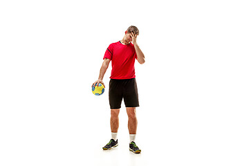 Image showing The one caucasian young man as handball player at studio on white background