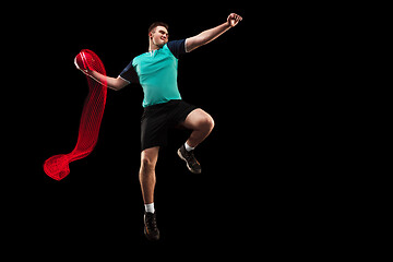 Image showing The one caucasian young man as handball player at studio on black background