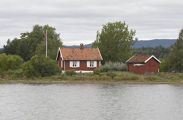 Image showing Small cottage on a small island. 