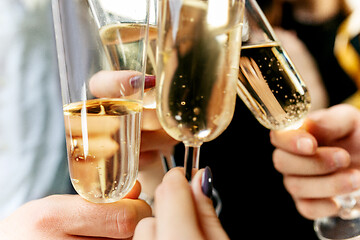 Image showing Celebration. Hands holding the glasses of champagne and wine making a toast.