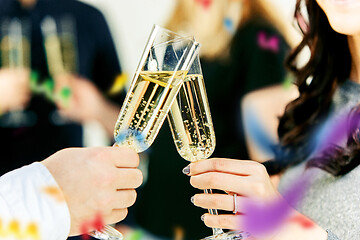 Image showing Celebration. Hands holding the glasses of champagne and wine making a toast.