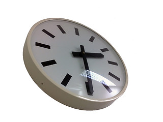 Image showing White wall clock on a white background