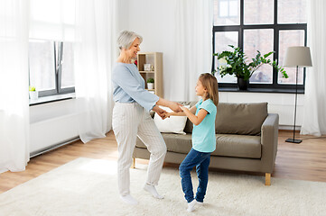 Image showing grandmother and granddaughter having fun at home