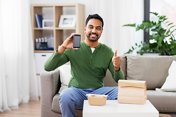 Image showing indian man using smartphone for food delivery