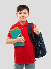 Image showing boy with books and school bag showing thumbs up