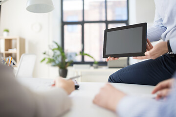 Image showing close up of business team with tablet pc at office