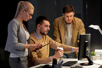 Image showing business team with computer working late at office