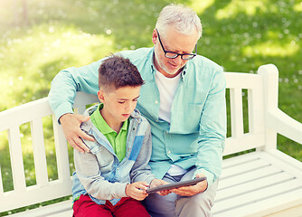 Image showing grandfather and boy with tablet pc at summer park