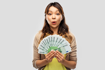 Image showing asian woman with hundred euro money banknotes