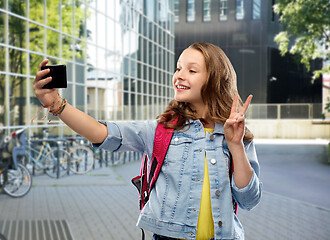 Image showing teenage student girl taking selfie by smartphone