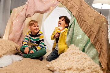 Image showing happy boys with torch light in kids tent at home