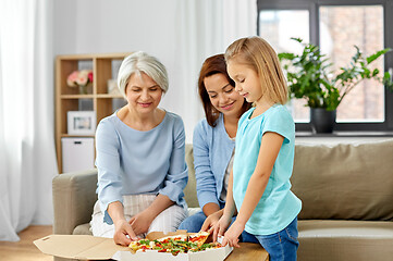 Image showing mother, daughter and grandmother eating pizza