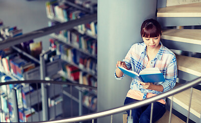 Image showing high school student girl reading book at library