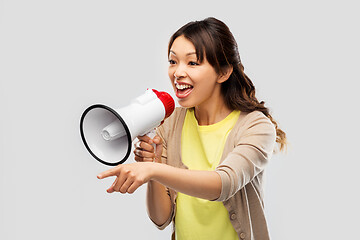 Image showing asian woman speaking to megaphone