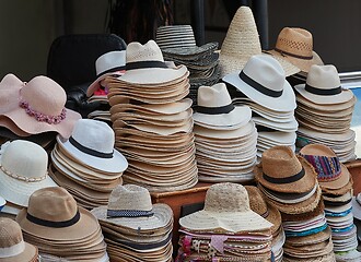 Image showing Hats in piles on a market