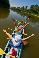 Image showing Canoeing on a river, girls in the boat