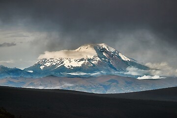 Image showing Chimborazo peak in the distance, dark clouds