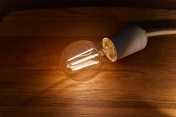 Image showing Light bulb on a table