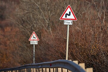 Image showing Rural road traffic signs warning about bends