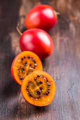 Image showing Fresh tamarillo fruit on wooden background