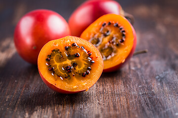 Image showing Fresh tamarillo fruit on wooden background