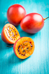 Image showing Fresh tamarillo fruit on wooden background