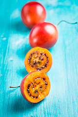 Image showing Fresh tamarillo fruit on wooden background