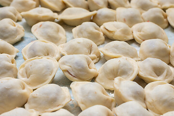 Image showing Blinded homemade dumplings lie on the table