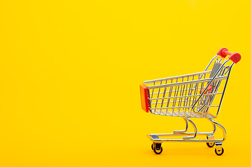 Image showing Food cart on an orange background, empty place for an inscription