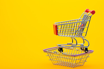 Image showing On an empty grocery cart is an empty grocery cart