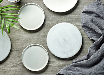 Image showing various empty white plates