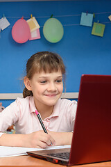 Image showing Happy girl studying in quarantine at home online