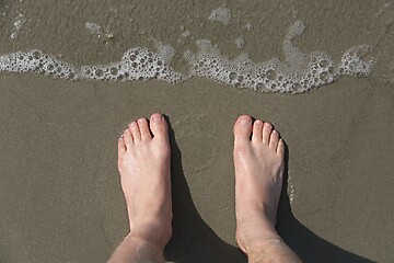 Image showing Bare feet on a beach