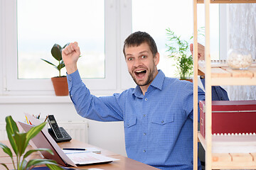 Image showing Businessman in the office is very happy about a successful deal