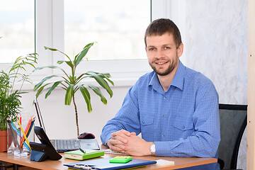 Image showing Successful business man in the office at the workplace