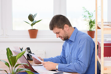 Image showing Office Specialist Reads Bad Investment a Report