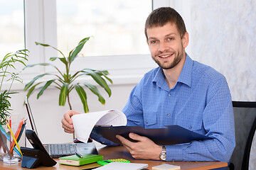 Image showing Successful male businessman at workplace in office