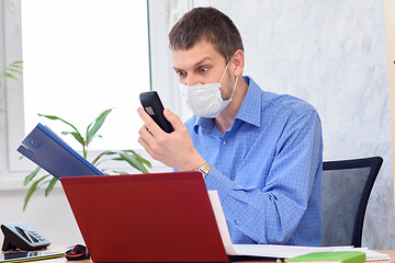 Image showing Business man rudely talking on the phone in the office