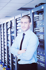 Image showing young it engeneer in datacenter server room