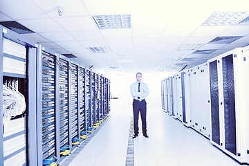 Image showing young it engeneer in datacenter server room