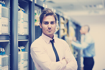 Image showing it enineers in network server room