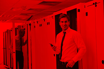 Image showing it enineers in network server room