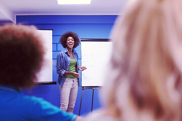 Image showing Black woman Speaker Seminar Corporate Business Meeting Concept