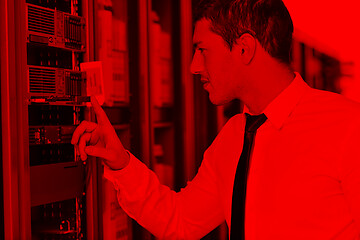 Image showing young engeneer in datacenter server room