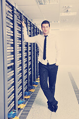 Image showing young engeneer in datacenter server room