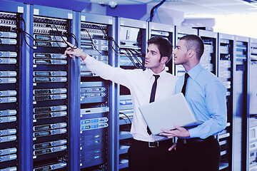 Image showing it enineers in network server room