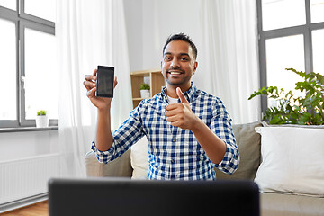 Image showing male blogger with smartphone videoblogging